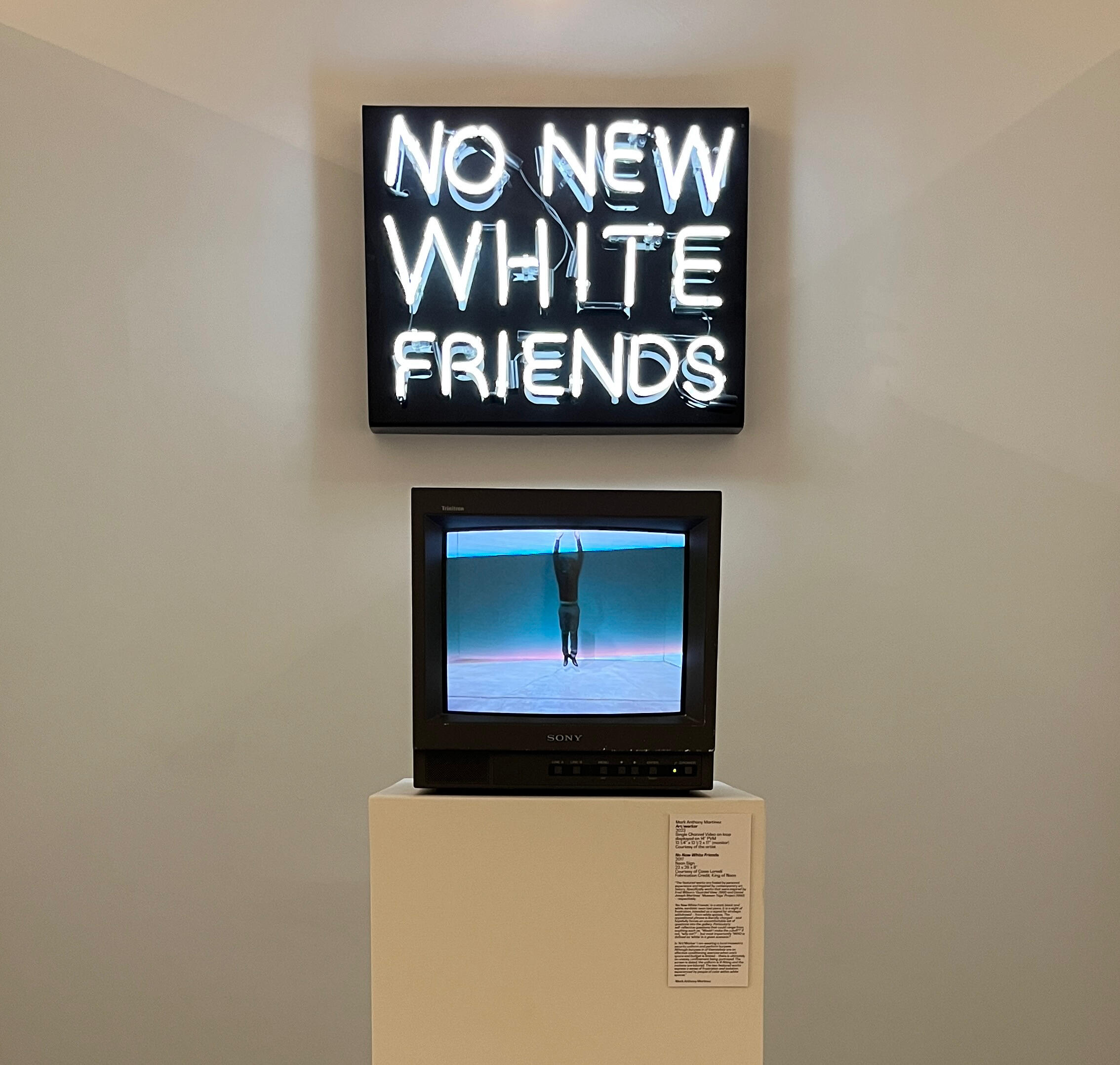 “No New White Friends,” neon art (fabrication credit King of Neon) (c/o Casie Lomeli’s Collection) and “art/worker,” video performance on PVM, as featured at the SA Contemporary for the curation “Vernacular Systems,” curated by Christopher Blay, 2024